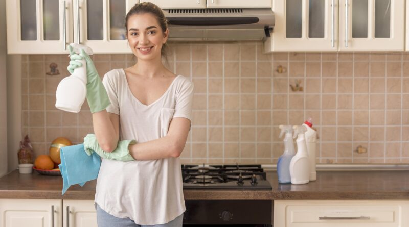 smiley woman kitchen holding ablution cloth