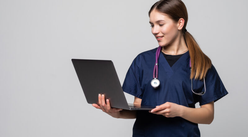 young female doctor working isolated white